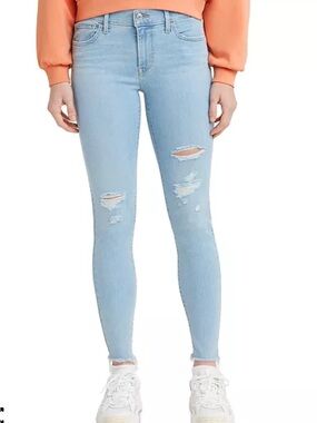 Levi’s 710 super skinny mid-rise light blue ripped jeans. 32